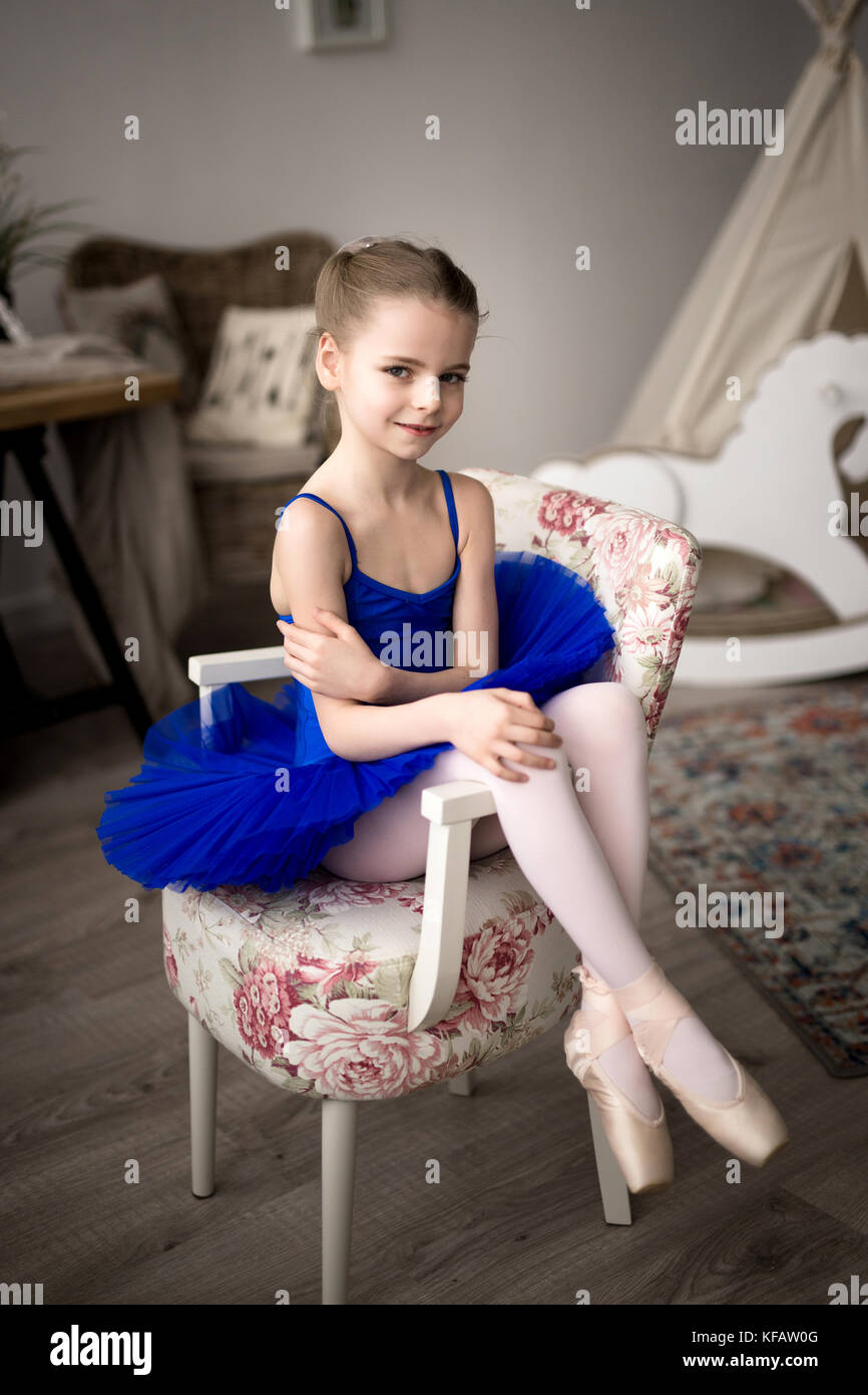 little girl dreams of a ballerina. Child girl in a blue ballet
