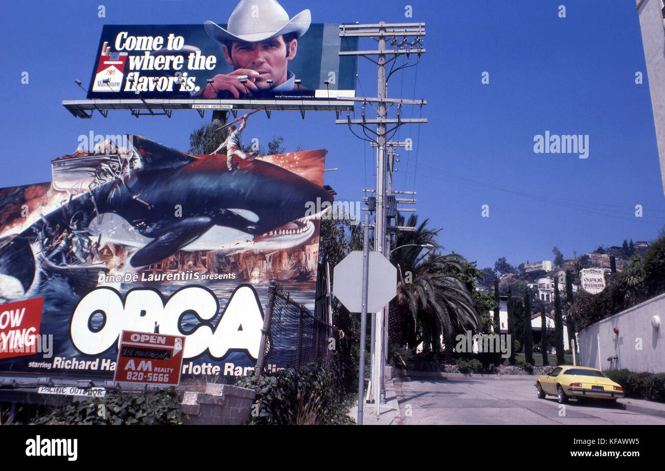 Marloboro billboard over Orca movie billboard on the Sunset Strip in Los Angeles, CA circa 1977 Stock Photo