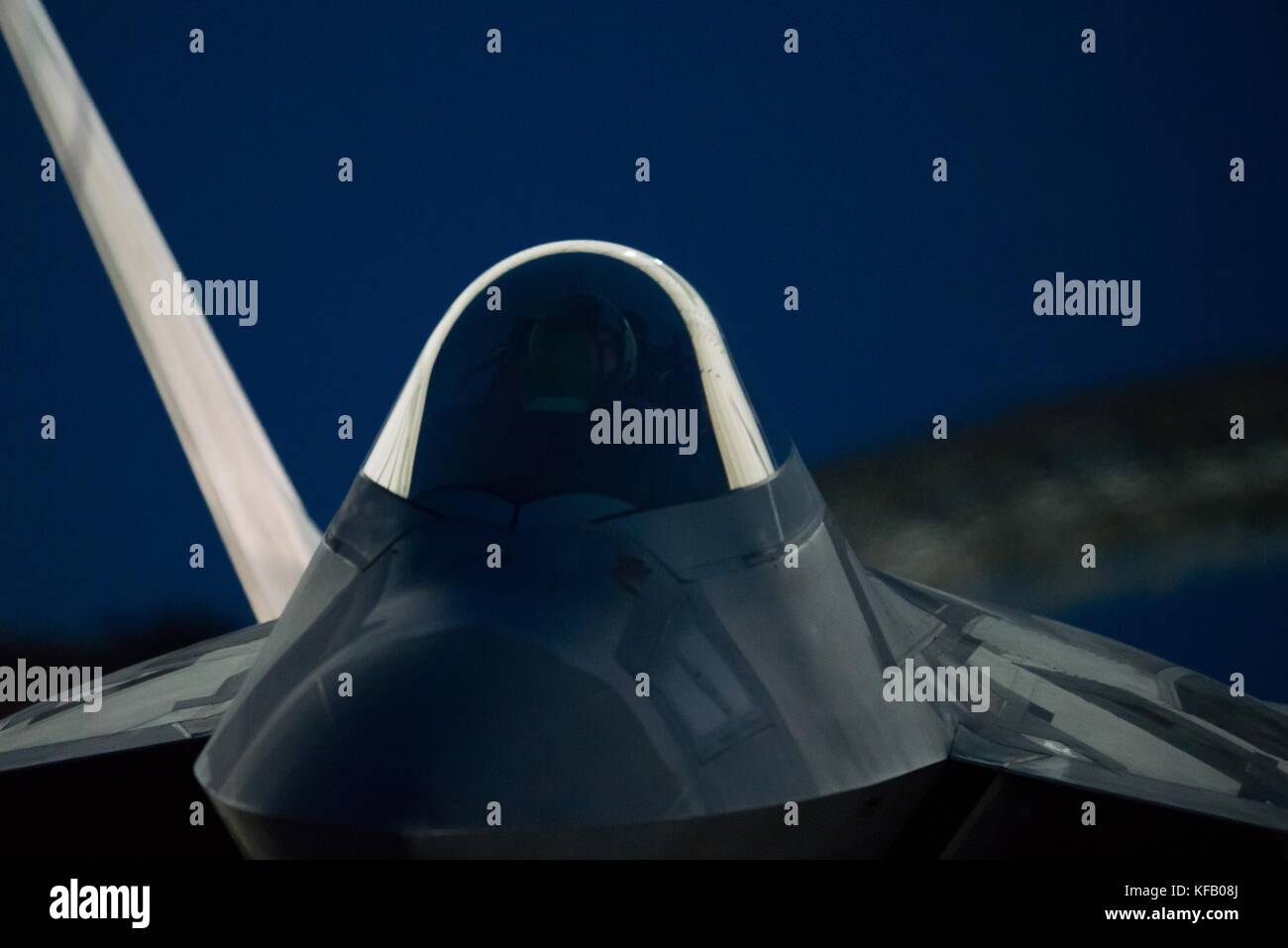 A U.S. Air Force F-22 Raptor stealth tactical fighter aircraft takes off from the runway at night at the Joint Base Langley-Eustis July 11, 2017 in Hampton, Virginia.   (photo by Benjamin Wilson via Planetpix) Stock Photo
