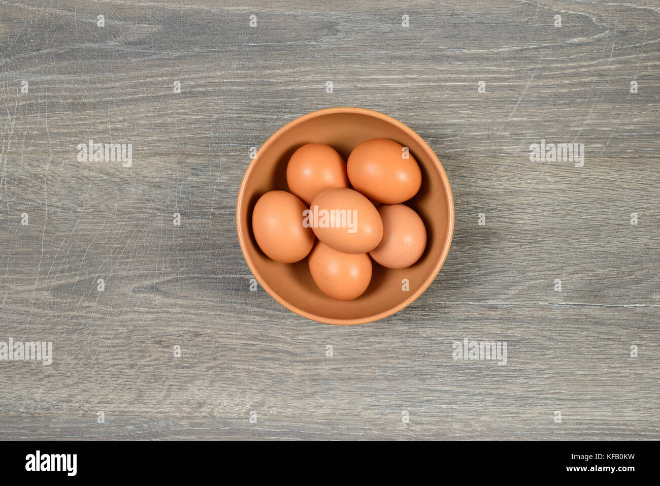 Eggs in deep dish on the table Stock Photo