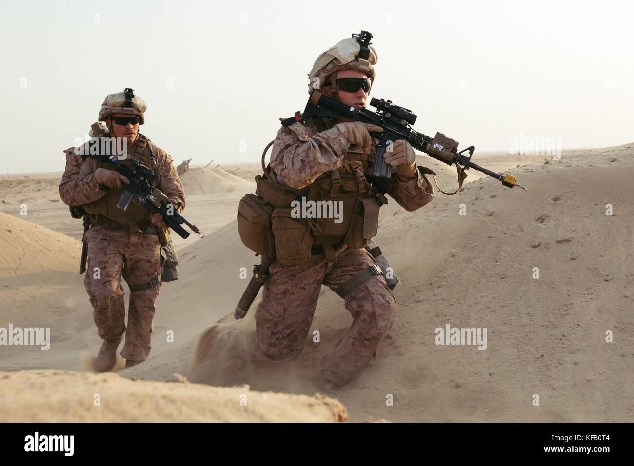 U.S. Marine Cpl. Matthew Lecompte and Lance Cpl. Dulton James with 2nd Battalion, 7th Marine Regiment run toward simulated casualties while training in the Middle East, Oct. 10, 2017. They are members of a quick reaction force that is capable of responding to developing situations on short notice. Marines with 2/7 were tasked to conduct a QRF to quickly recover simulated casualties and take them back to safety. This was the first exercise 2/7 has conducted after replacing 1st Battalion, 7th Marine Regiment in the U.S. Central Command area of operations. (photo by Cpl. Jocelyn Ontiveros via Pl Stock Photo