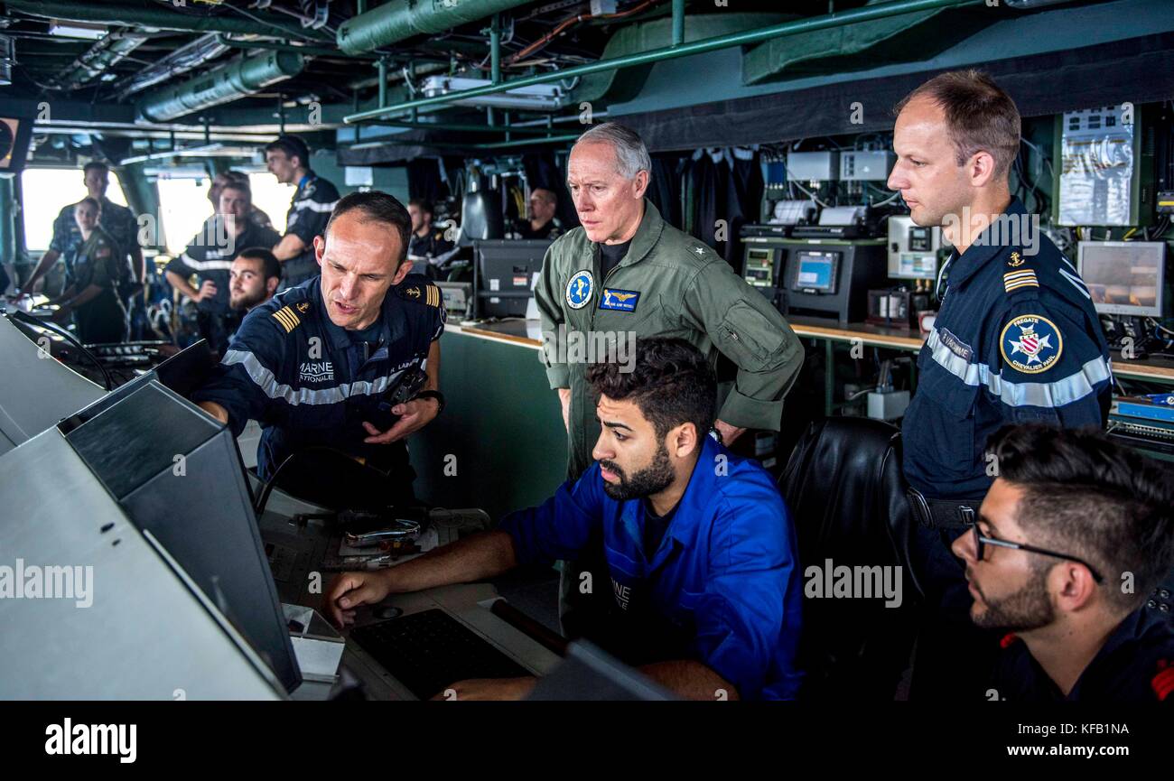 French Navy Commanding Officer Hugues Laine (left) shows U.S. Navy Commander Kenneth Whitesell the navigation radar aboard the French Navy Horizon-class missile destroyer frigate FS Chevalier Paul during Bastille Day July 14, 2017 in the Mediterranean Sea.   (photo by Hank Gettys via Planetpix) Stock Photo