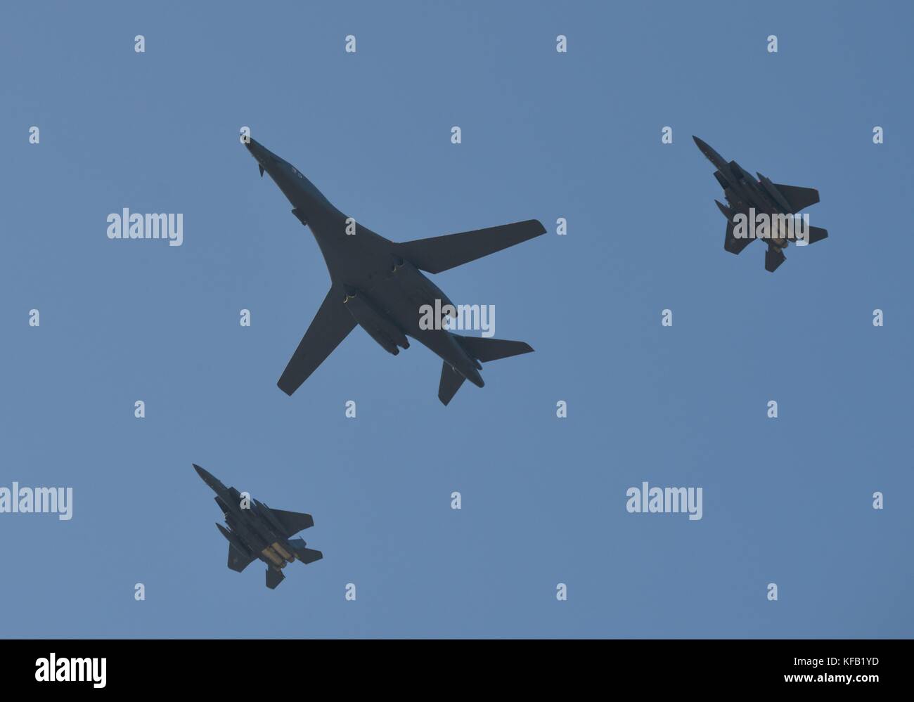 A U.S. Air Force B-1B Lancer strategic bomber aircraft and two South Korean Air Force F-15K Slam Eagle fighter aircraft fly in formation over the Seoul Airport during the Seoul Aerospace and Defense Exhibition October 21, 2017 in Seoul, Republic of Korea.   (photo by Alex Echols via Planetpix) Stock Photo