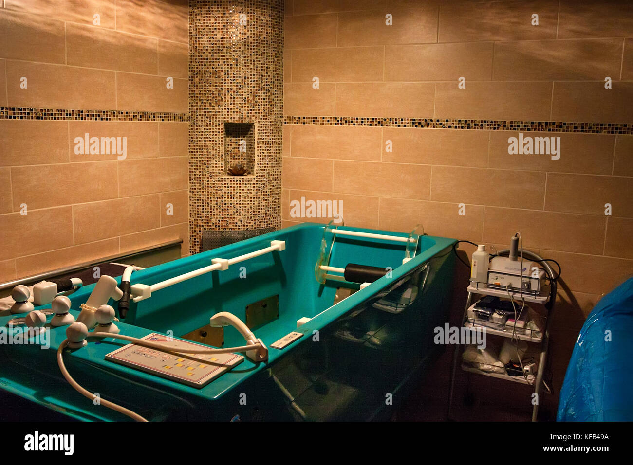 Green massage bathtub in spa hydrotherapy concept Stock Photo