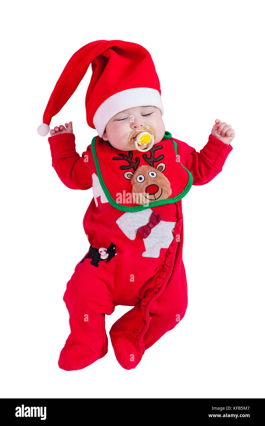Baby girl sleeping or asleep with pacifier or dummy, red onesie, Rudolph reindeer bib, Santa hat for Christmas. Isolated white background. 4 months Stock Photo