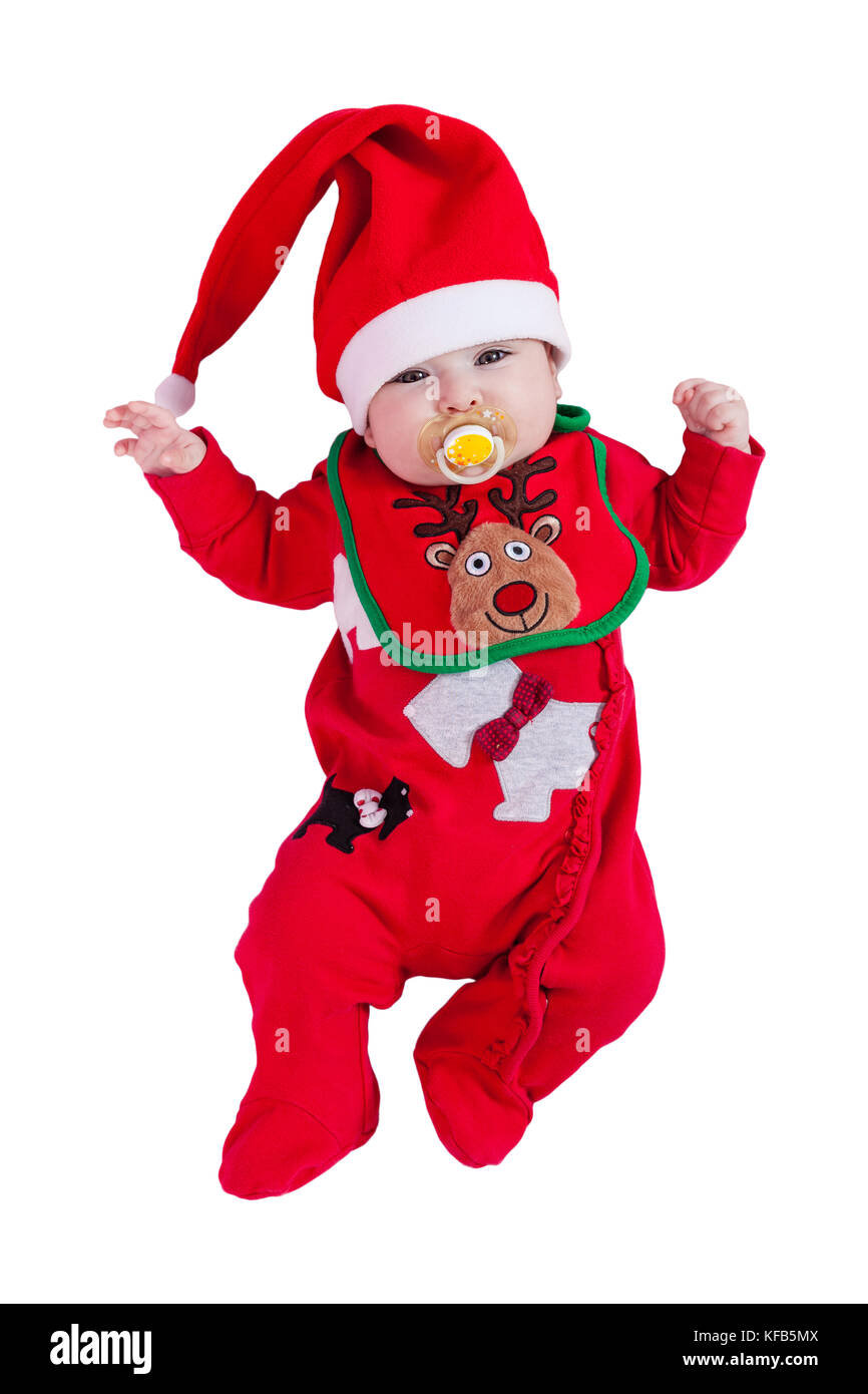 Baby girl with pacifier or dummy, red babygrow or onesie, Rudolph reindeer bib, Santa Claus hat for Christmas. Isolated white background. Four months Stock Photo