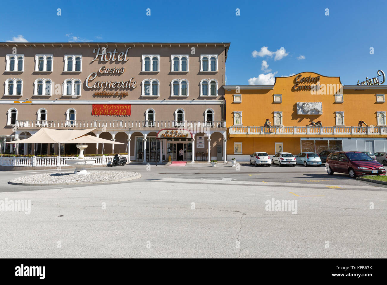 SKOFIJE, SLOVENIA - SEPTEMBER 21, 2017: Cars parked in front of welness and spa Hotel Casino Carnevale close to highway on the border between Slovenia Stock Photo