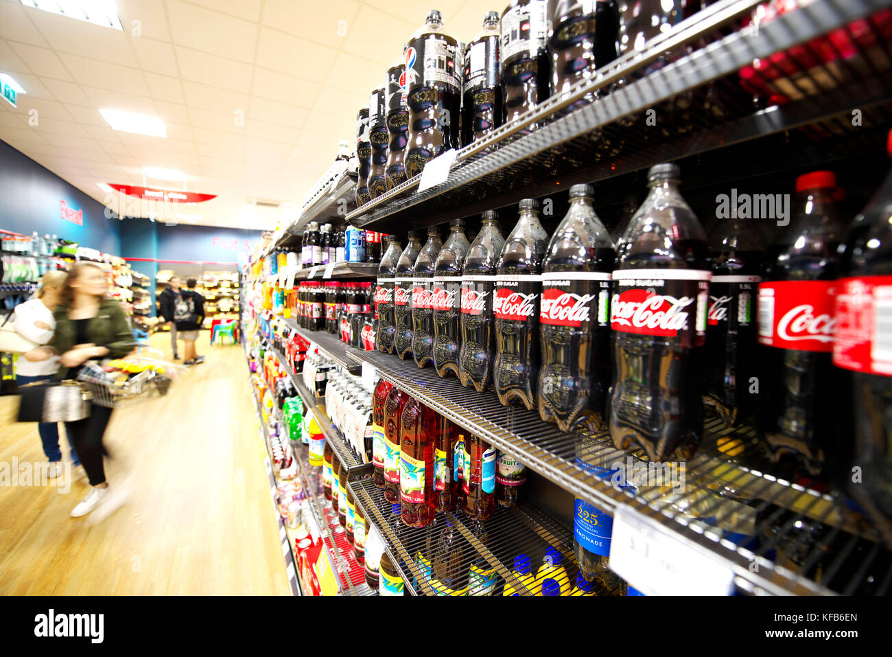 Shelves full of fat fizzy and zero sugar fizzy drinks for children and