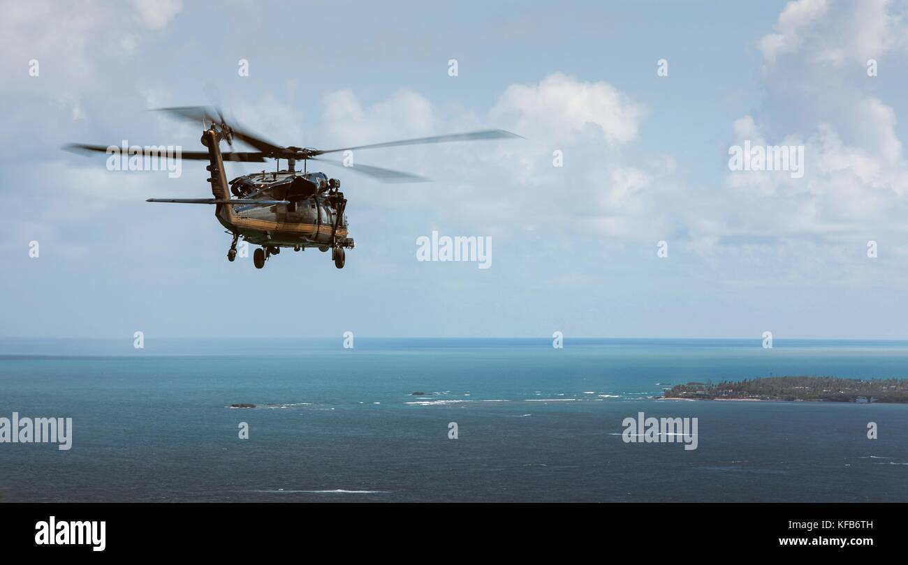 A U.S. Customs and Border Protection UH-60 Black Hawk helicopter surveys the damage in the aftermath of Hurricane Maria October 13, 2017 in Puerto Rico.   (photo by Ozzy Trevino via Planetpix) Stock Photo