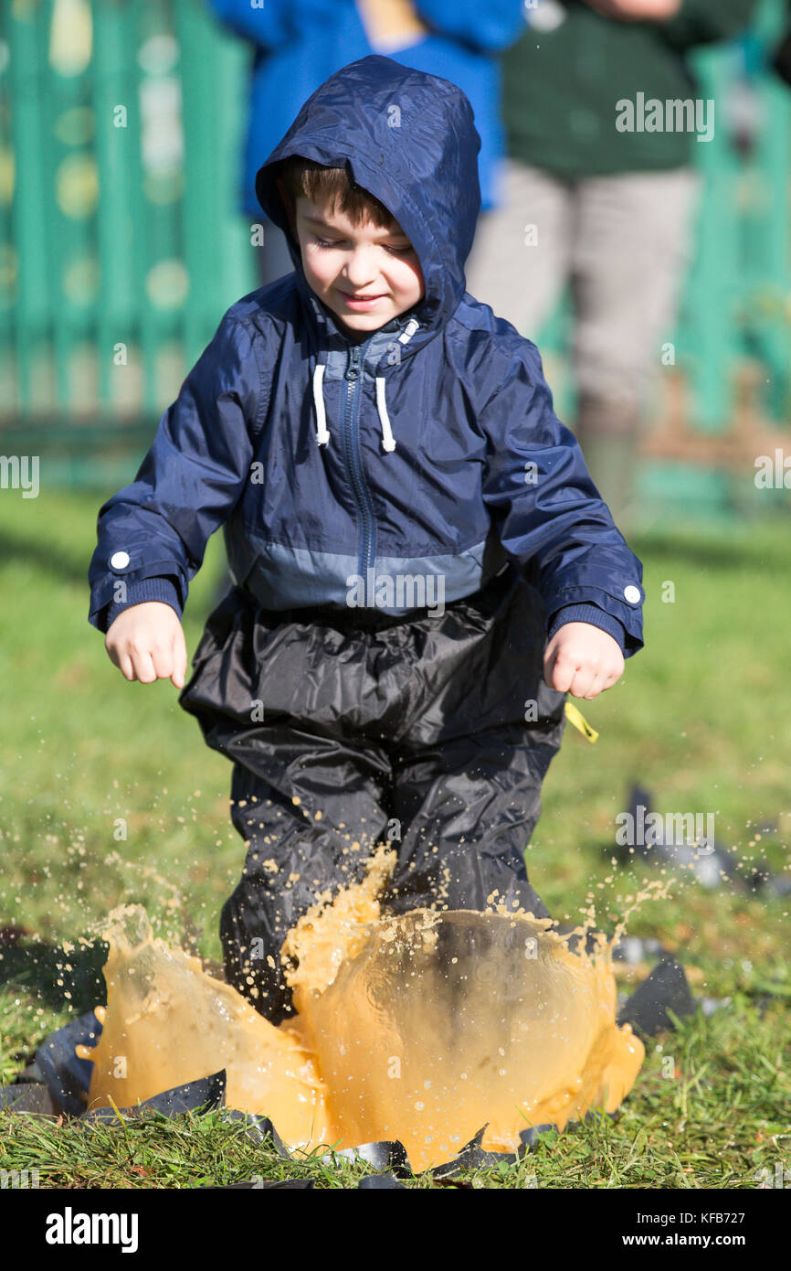 The World Puddle Jumping Championships at Wicksteed Park in Northamptonshire on Wednesday October 25th.  Youngsters have been making a splash at the World Puddle Jumping Championships at Wicksteed Park in Northamptonshire today (Wed).  Competitors battled it out to make the biggest splash at the fifth annual contest in Kettering.  Organisers created a special series of championship-standard puddles and judges gave scores based on things such as height of jump, enthusiasm, distance of splash and stickability (the amount of mud which clings to each competitor). Stock Photo