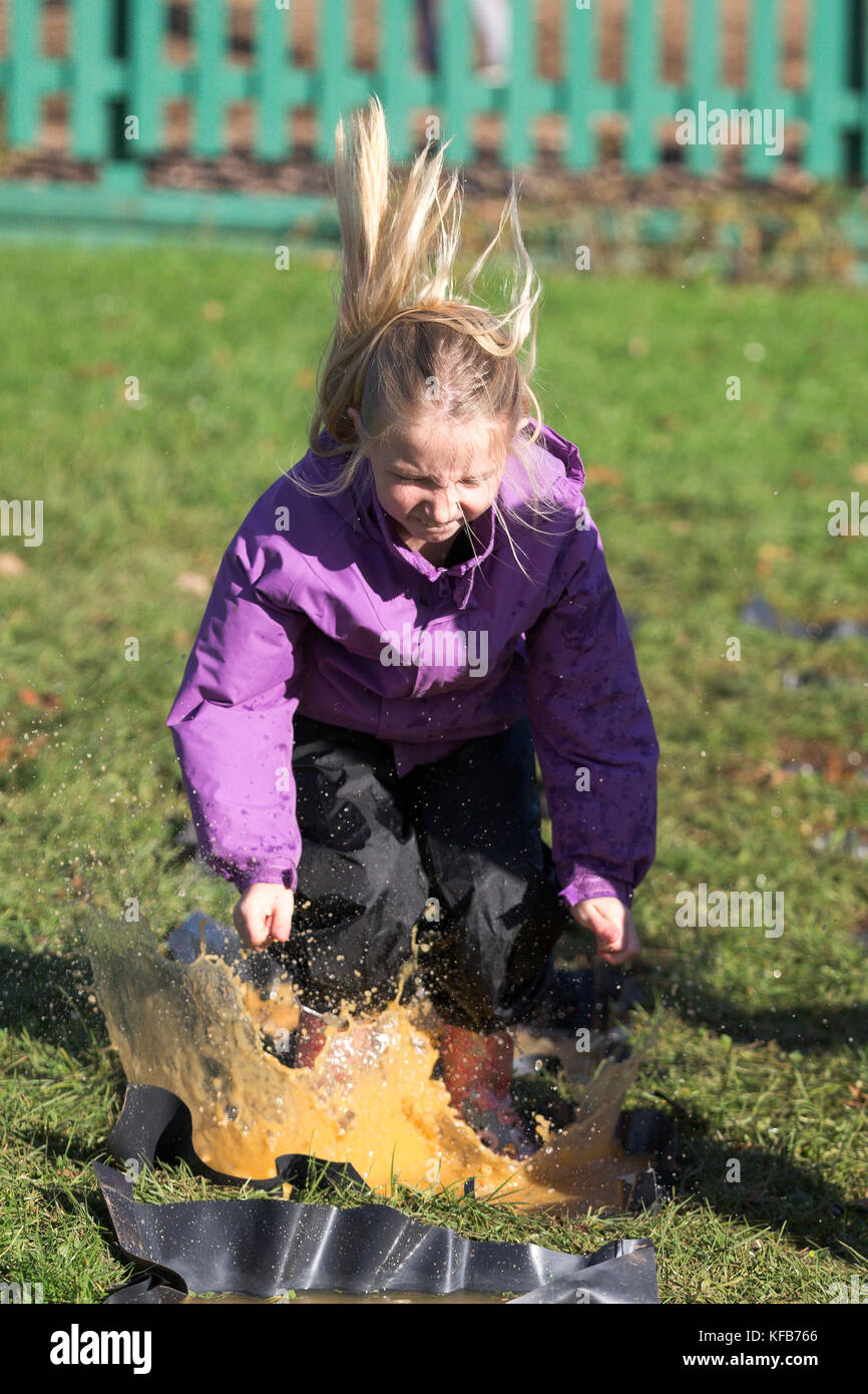 The World Puddle Jumping Championships at Wicksteed Park in Northamptonshire on Wednesday October 25th.  Youngsters have been making a splash at the World Puddle Jumping Championships at Wicksteed Park in Northamptonshire today (Wed).  Competitors battled it out to make the biggest splash at the fifth annual contest in Kettering.  Organisers created a special series of championship-standard puddles and judges gave scores based on things such as height of jump, enthusiasm, distance of splash and stickability (the amount of mud which clings to each competitor). Stock Photo