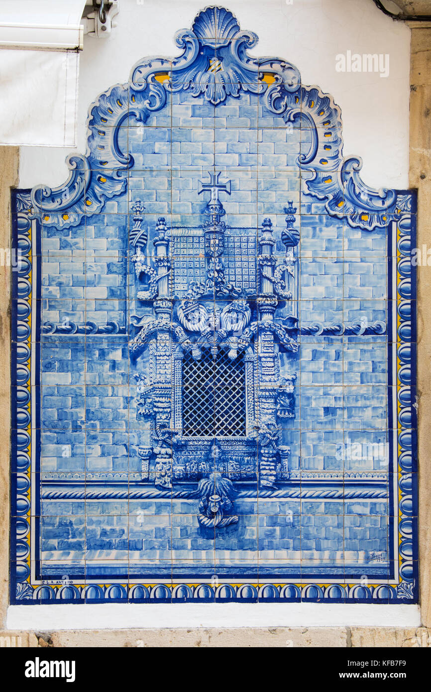 Azulejo blue ceramic tiles of the famous Chapterhouse Window, Convent of Christ, outside a restaurant, Tomar, Ribatejo Province, Portugal Stock Photo