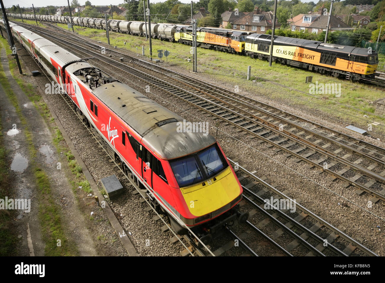 Virgin Trains East Coast class 91 electric loco passing Colas Rail ...