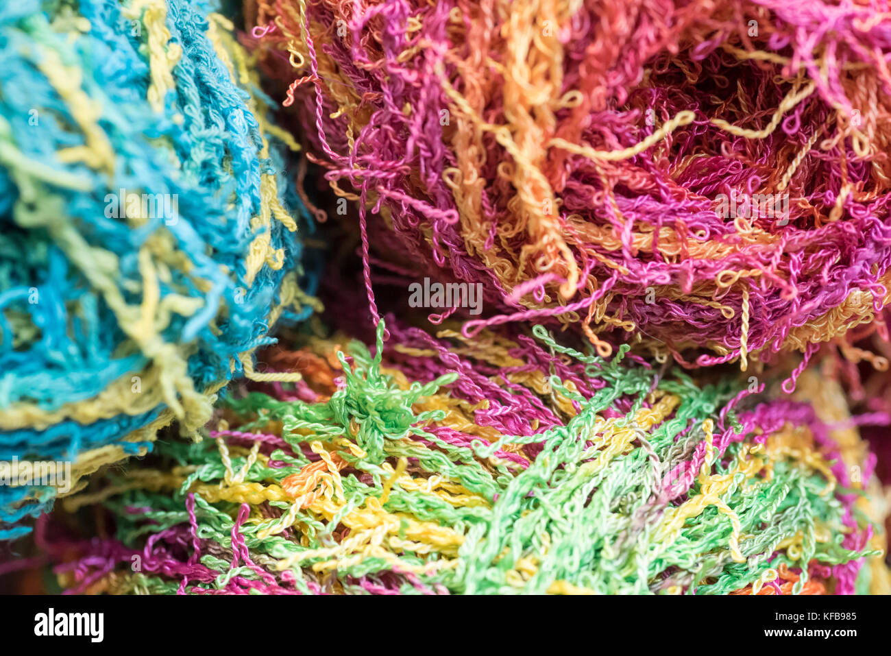 Several brightly colored skeins of yarn Stock Photo