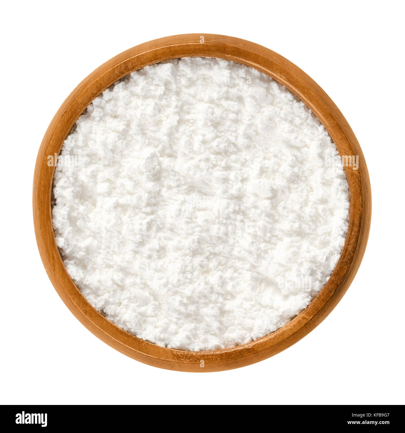 Powdered sugar in wooden bowl. Unsifted finely ground white refined sugar. Also called confectioners or icing sugar and icing cake. Photo. Stock Photo