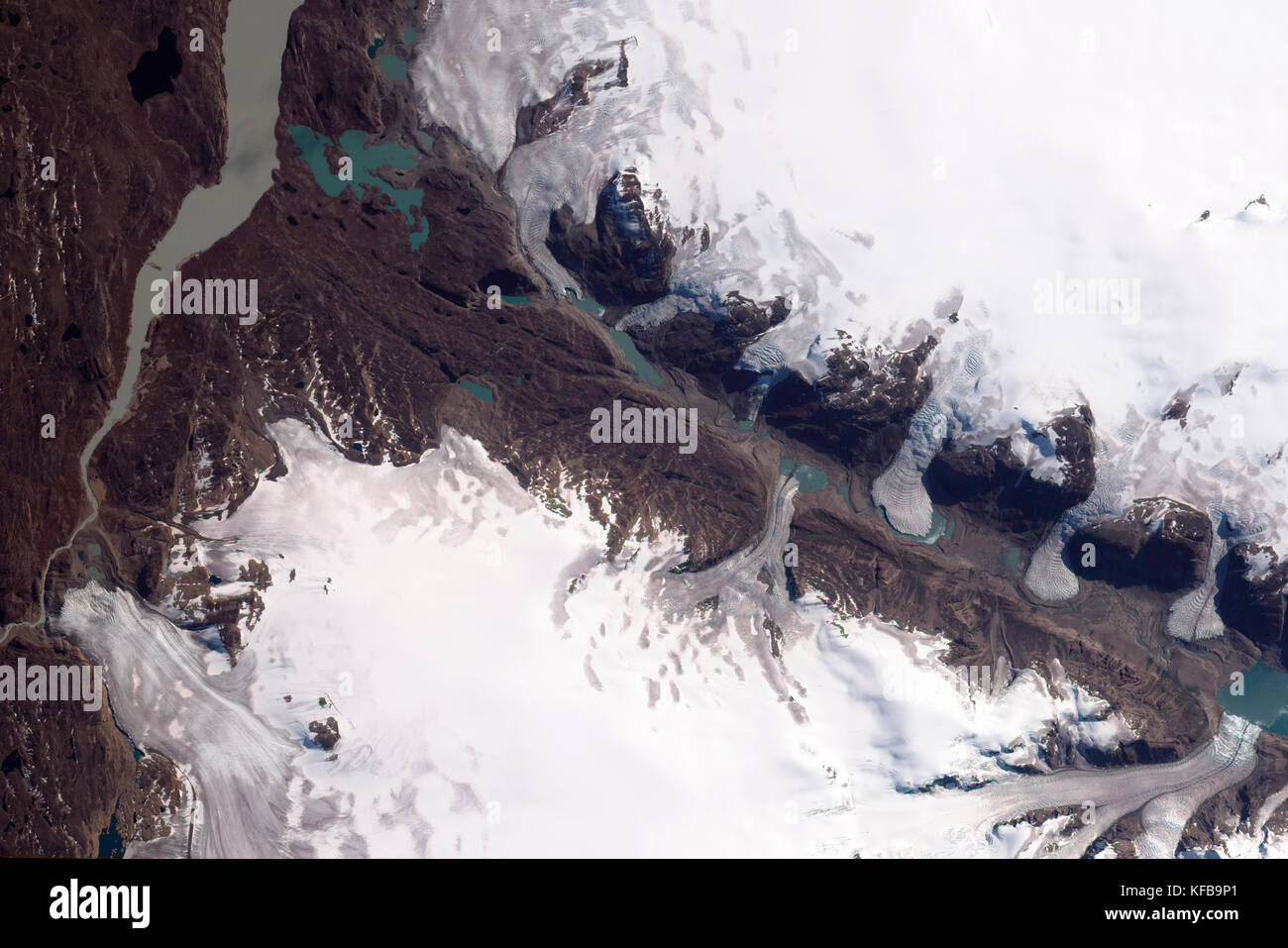 Small glaciers spill into a mostly dry valley in western Greenland in this picture from August 29, 2009. Stock Photo