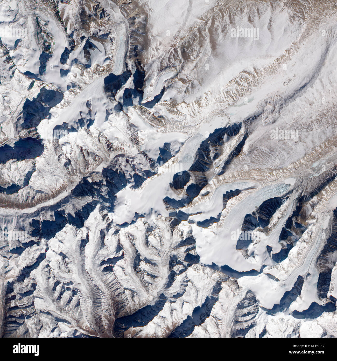 Besides the world's tallest peaks, the Himalayan Mountain Range holds thousands of glaciers. In southern China, just north of the border with Nepa. Stock Photo