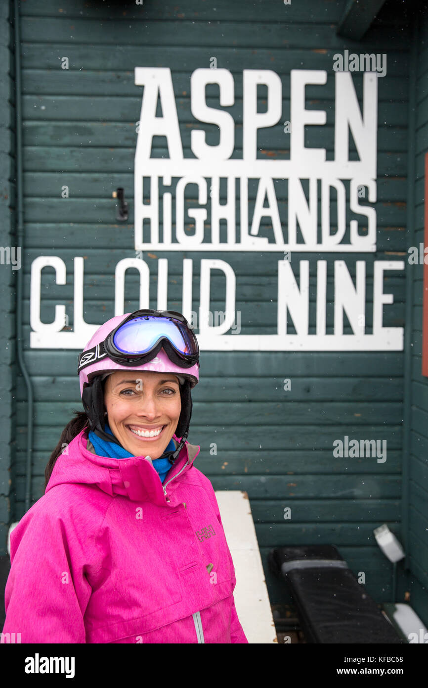 USA, Colorado, Aspen, a woman smiles in front of the Cloud Restaurant, Aspen Highlands Ski Resort Stock Photo