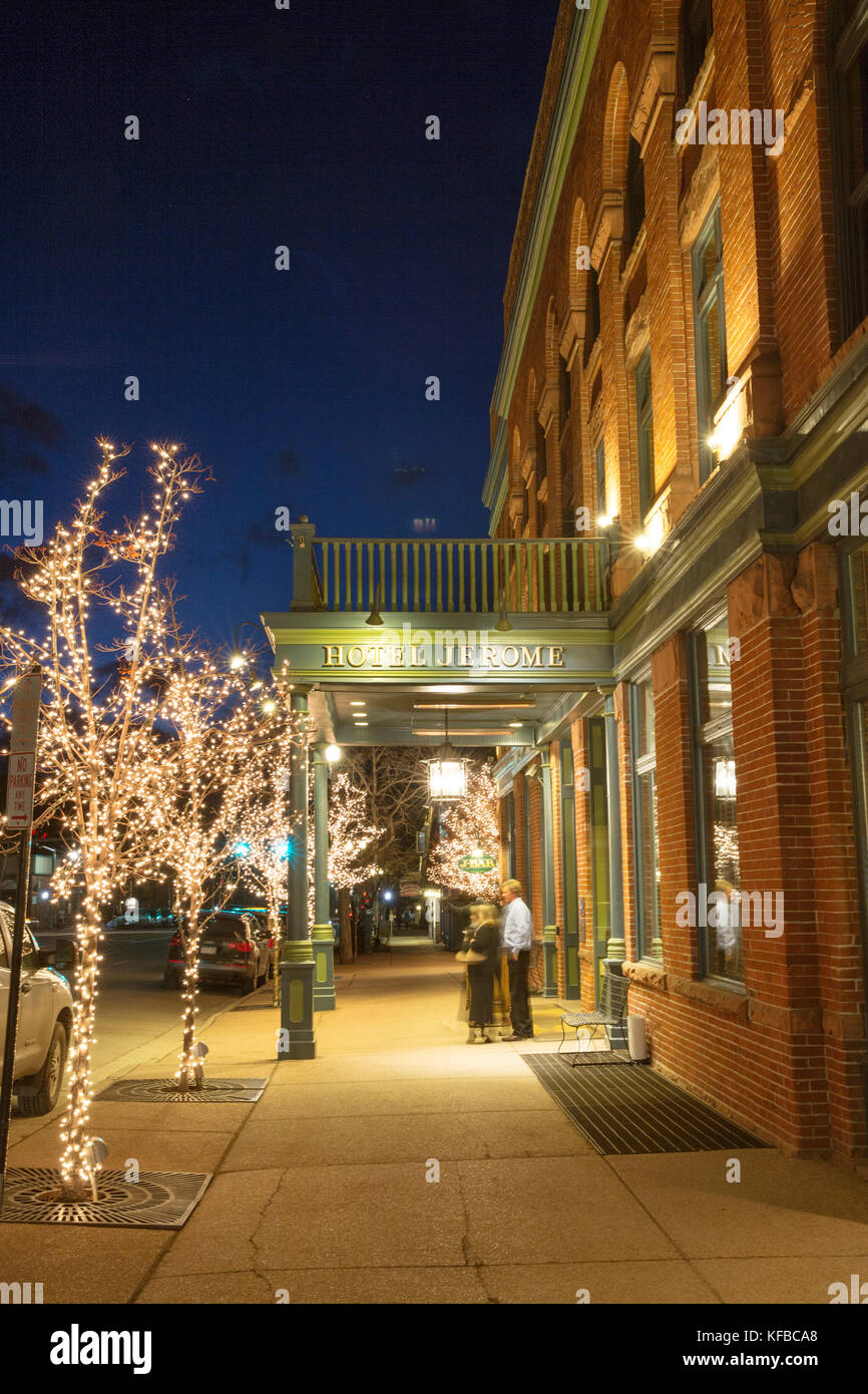 USA, Colorado, Aspen, exterior shot of people in front of the Jerome Hotel at dusk, Main Street Stock Photo