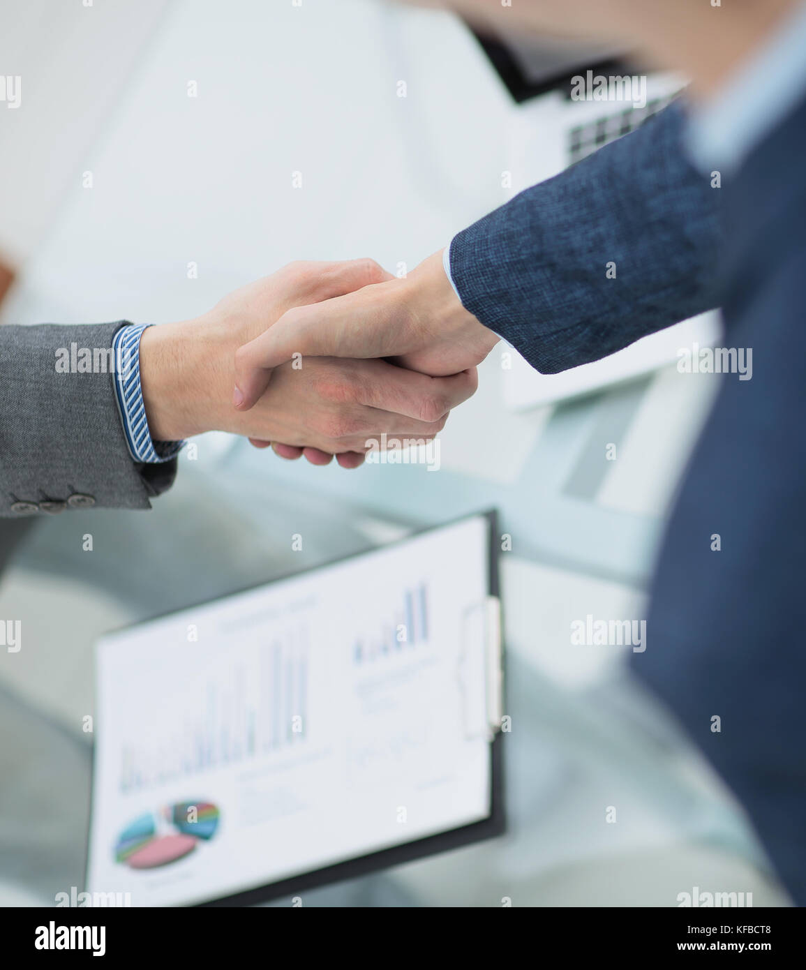 businessman shaking hands to seal a deal with his partner Stock Photo