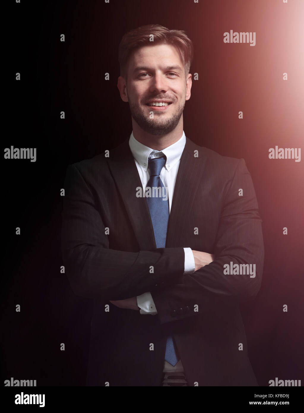 Handsome elegant business man isolated on black Stock Photo - Alamy