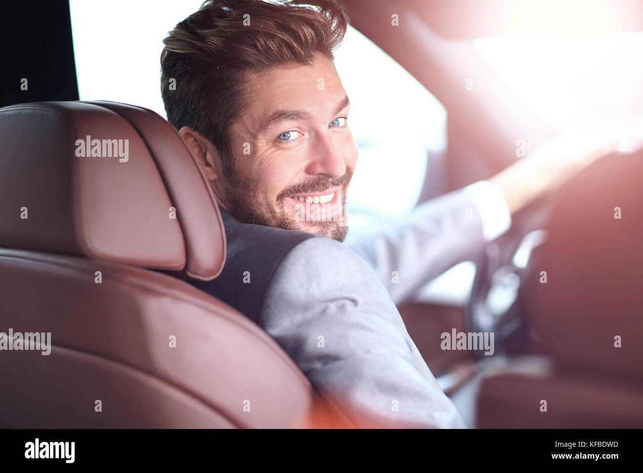 Portrait of an handsome smiling business man driving his car Stock ...