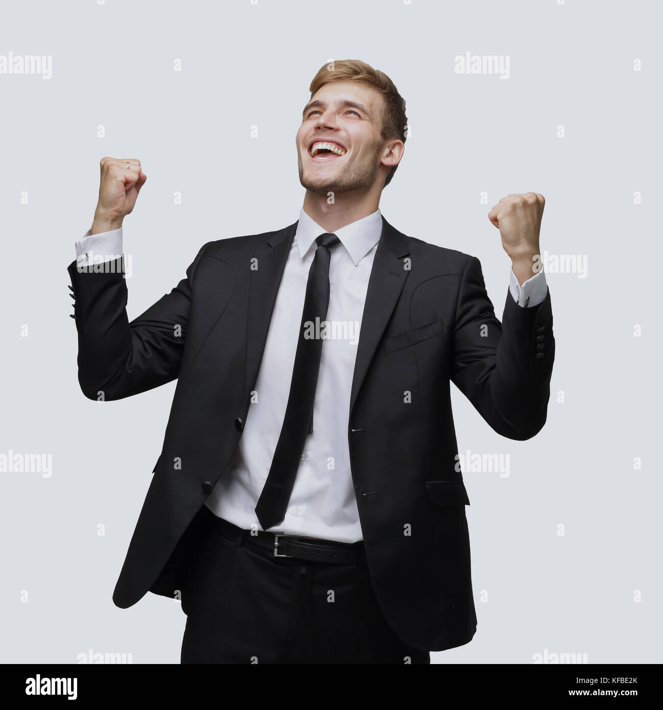 Business man celebrating a triumph with arms up Stock Photo - Alamy