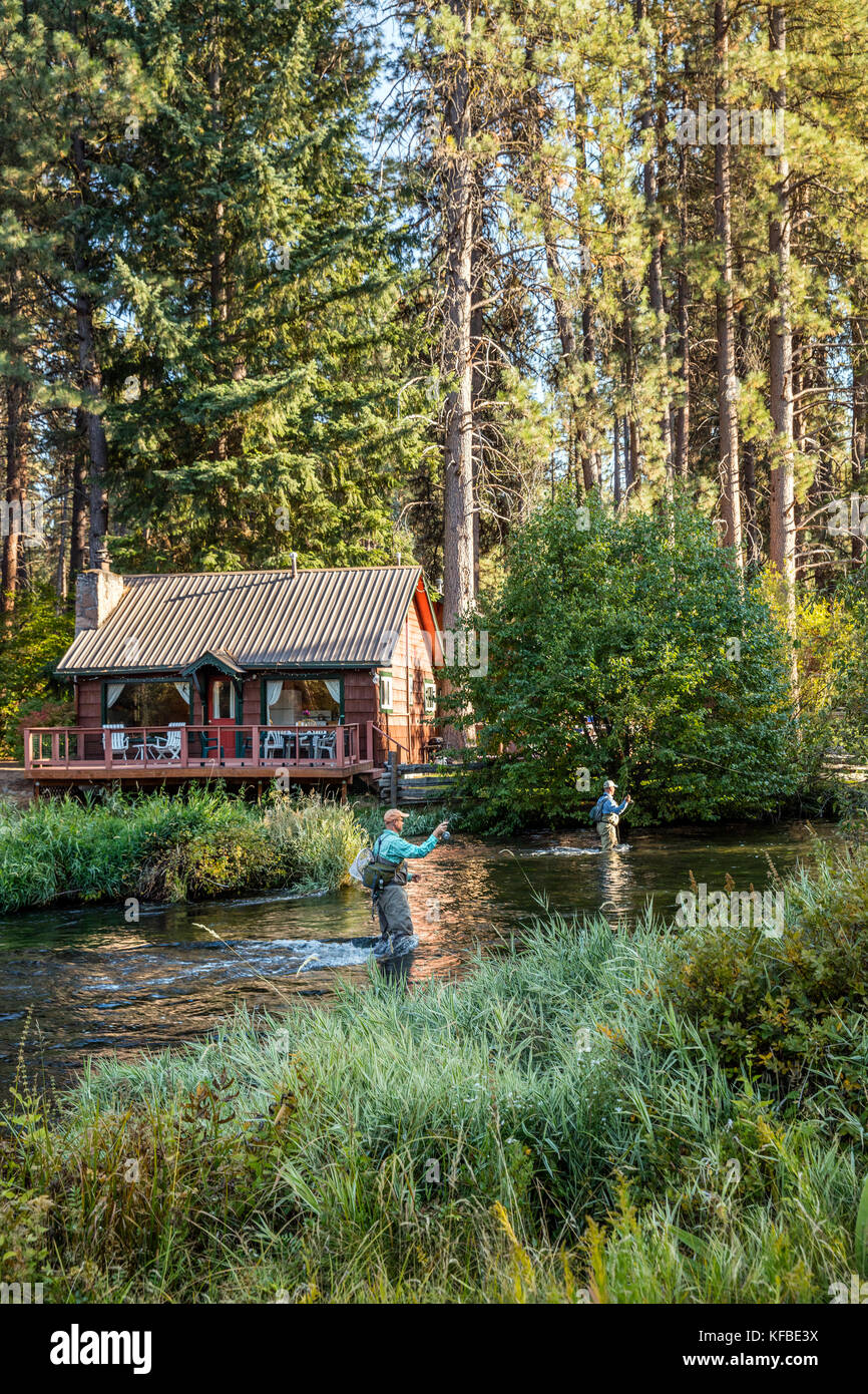 USA, Oregon, Camp Sherman, Metolius River Resort, Flyfishermen on the Metolius looking away from resort Stock Photo