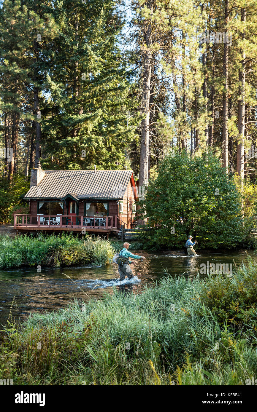 USA, Oregon, Camp Sherman, Metolius River Resort, Flyfishermen on the Metolius looking away from resort Stock Photo