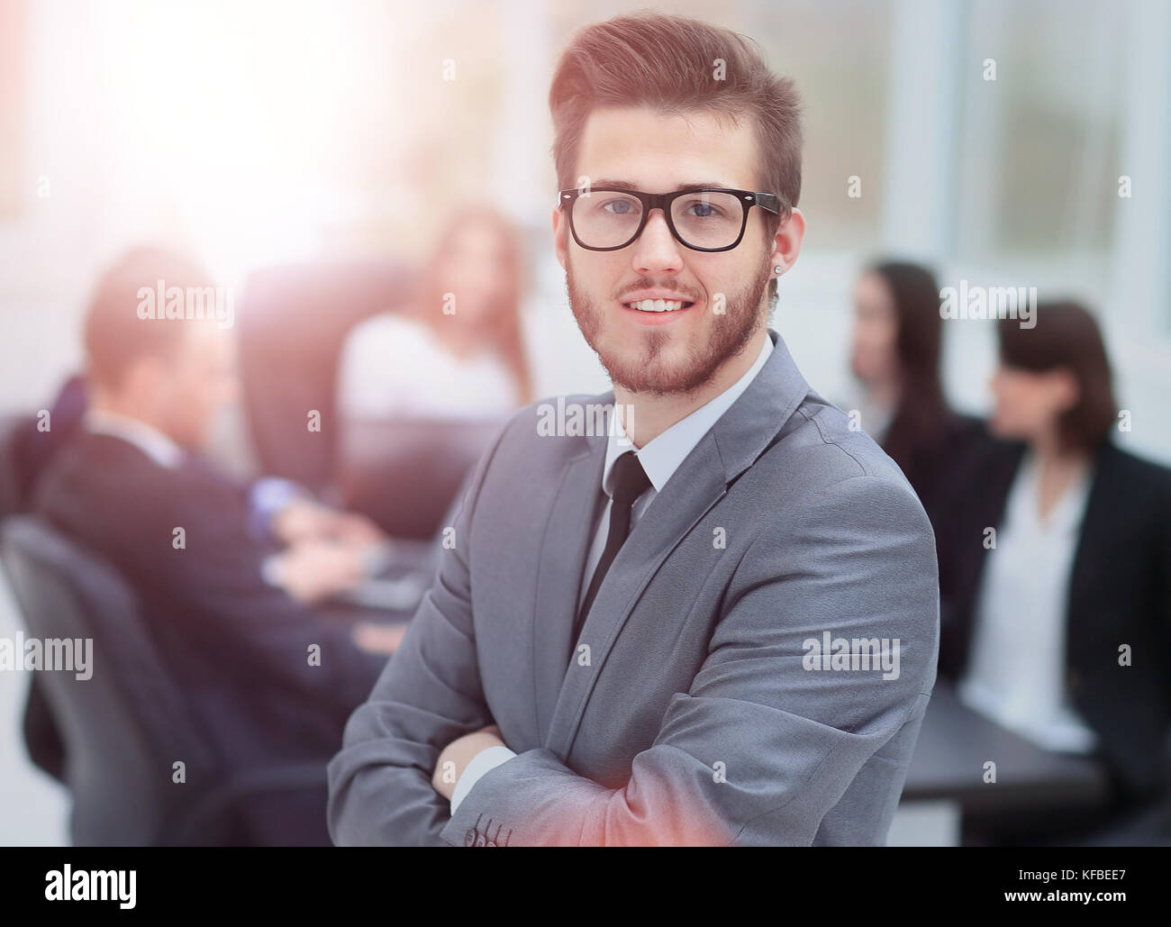 Portrait of an handsome businessman in front of his team Stock Photo ...