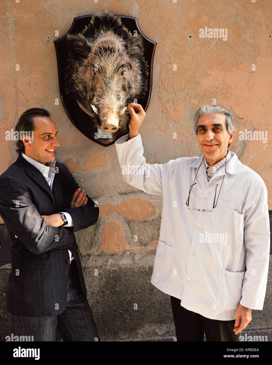 ITALY, Orvieto, Umbria, Chef Alex Palermo standing with Butcher Emilio
