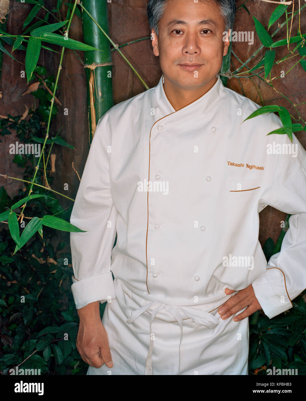 USA, Nevada, chef Takashi Yagihashi standing with hand on hip, portrait Stock Photo