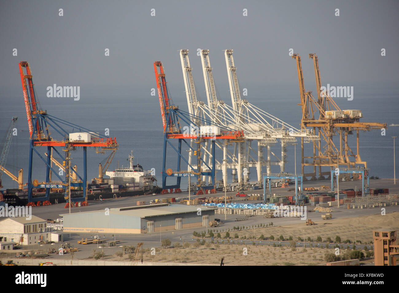 Heavy-duty cranes towering above the first, 602-meter long quay of the port of Gwadar in Baluchsitan, in the southernmost tip of Pakistan, 03 October 2017. This is the site of what is supposed to become a giant trade port. Gwadar is a hub of the planned so-called 'China-Pakistan Economic Corridor', or CPEC for short. The corridor is part of China's 'New Silk Road', a world-wide network of trade routes. Photo: Christine-Felice Röhrs/dpa Stock Photo