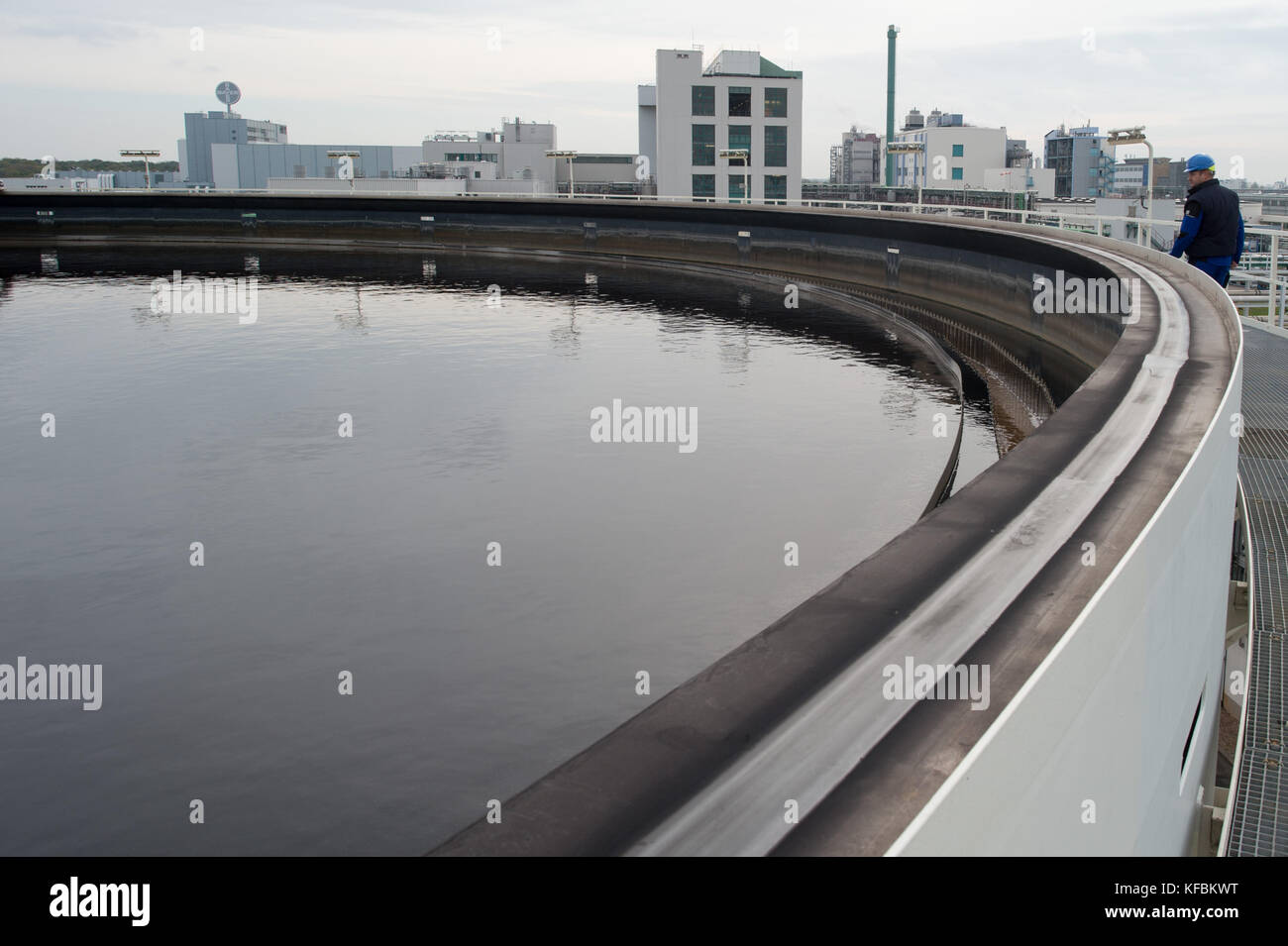 A worker walking over a biohoch reactor at the Community Sewage