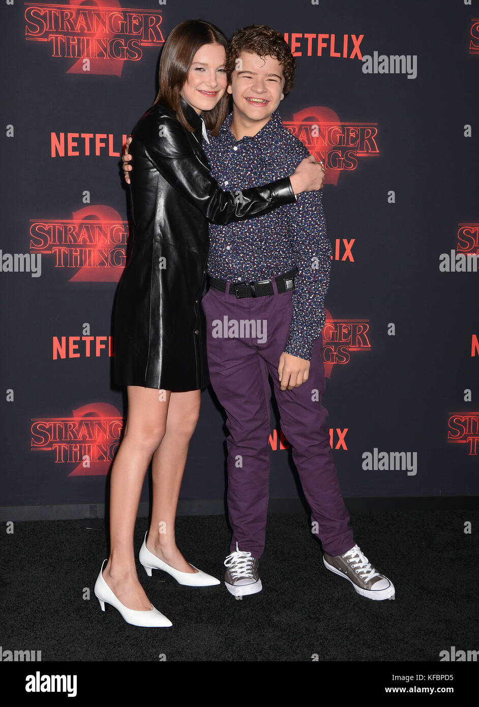 WESTWOOD, LOS ANGELES, CA, USA - OCTOBER 26: Actress Millie Bobby Brown  wearing a Calvin Klein dress arrives at the Los Angeles Premiere Of  Netflix's 'Stranger Things' Season 2 held at the