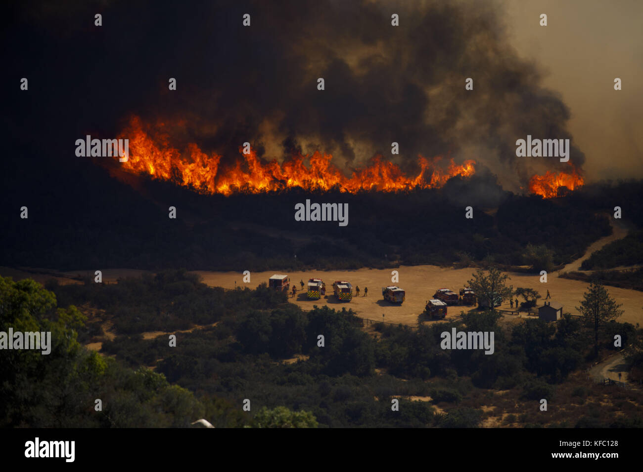 Wildomar, California, USA. 26th Oct, 2017. Firefighters battle the Wildomar wildfire in the Cleveland National Forest on Thursday, October 26, 2017 in Wildomar, Calif. The fire started after a motorcycle crashed into a tree. © 2017 Patrick T Fallon Credit: Patrick Fallon/ZUMA Wire/Alamy Live News Stock Photo