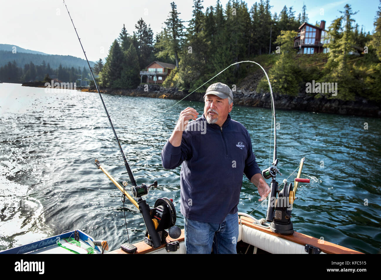 USA, Alaska, Ketchikan, Captain Tony tending to his lines while fishing the Behm Canal near Clarence Straight, Knudsen Cove along the Tongass Narrows Stock Photo