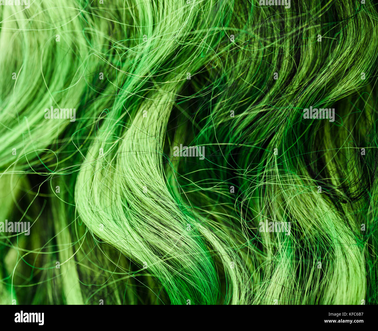 Green wig hair background. Stock Photo