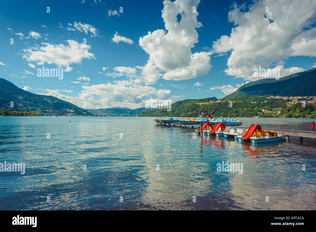Caldonazzo alpine lake near Trento blue water and catamarans Stock Photo