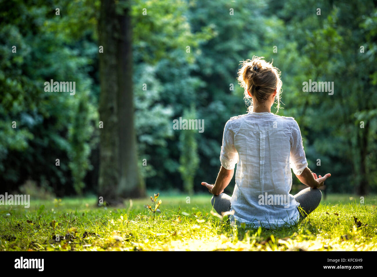 Young girl practicing joga and meditating Stock Photo