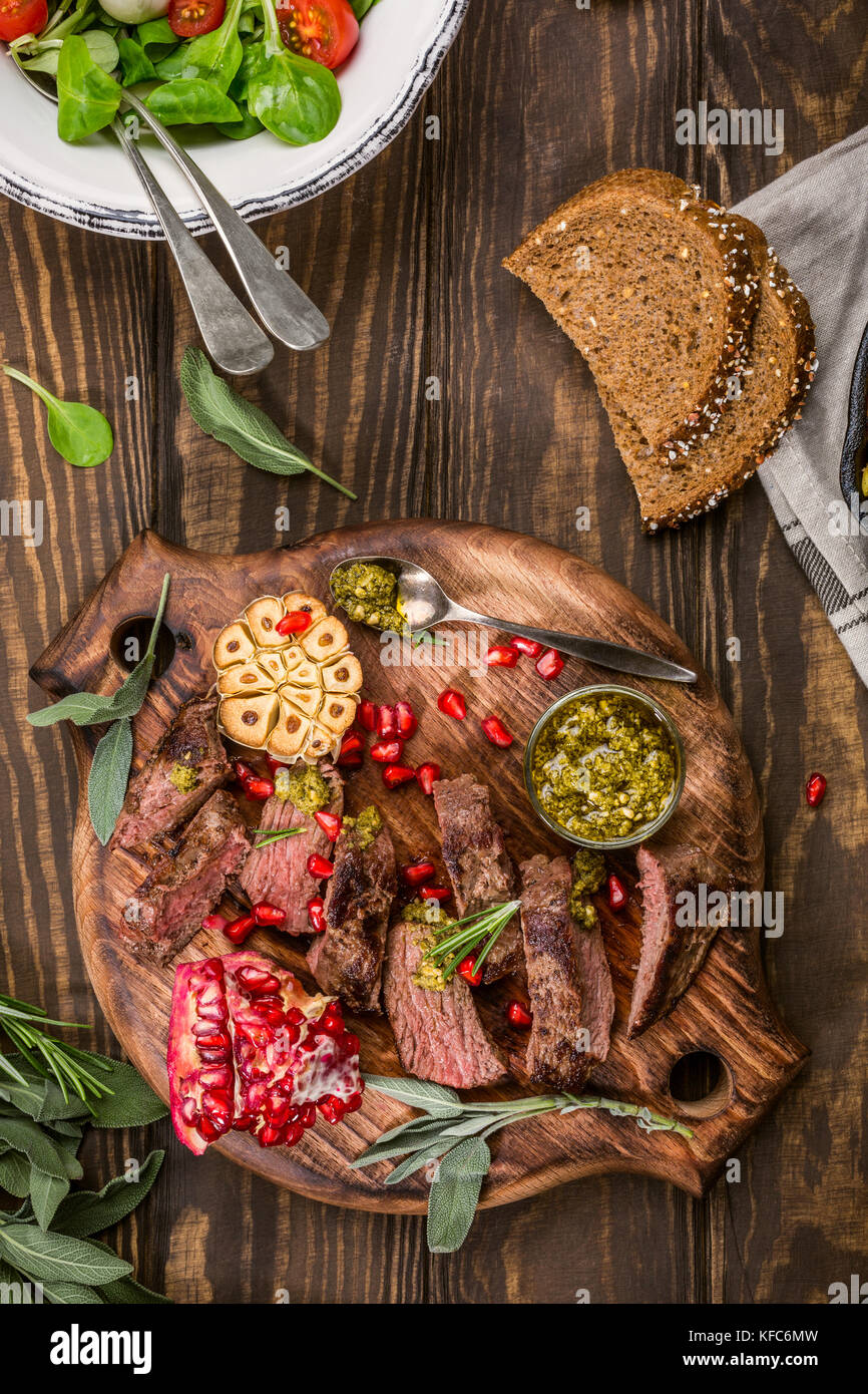 Meat steak with green pesto Stock Photo Alamy