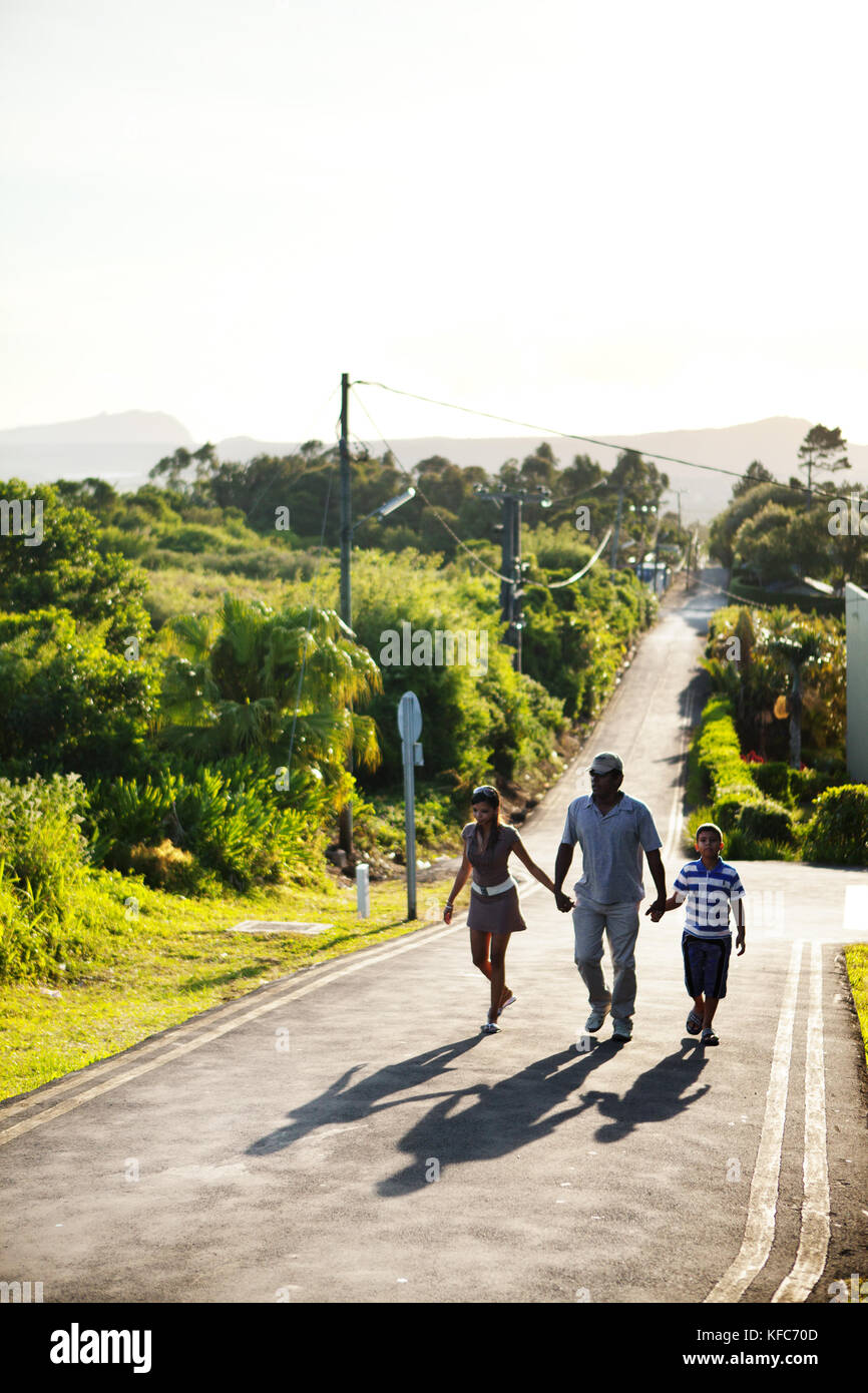 MAURITIUS, a family nears the top of a long road to have a look into Troux aux Cerfs crater, the town of Curepipe Stock Photo