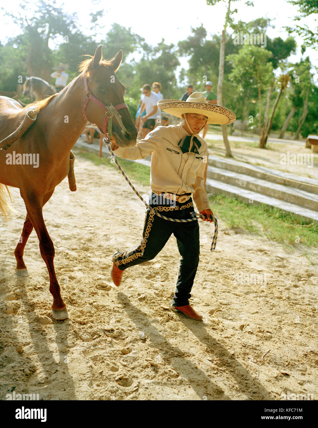 MEXICO, Maya Riviera, Mexican Cowboy leading his horse, Yucatan Peninsula Stock Photo