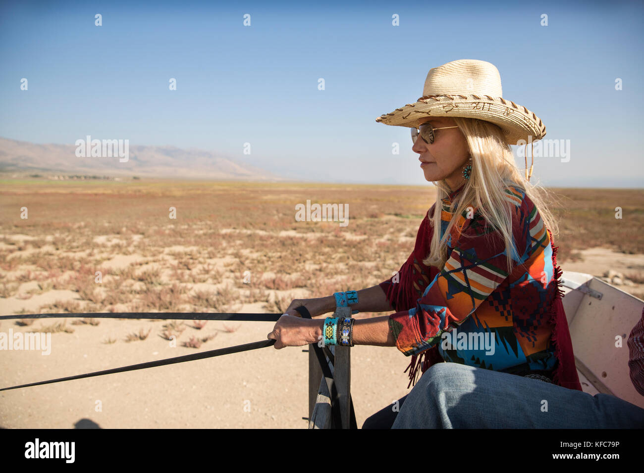 USA, Nevada, Wells, Founder Madeleine Pickens leads a HorseDrawn Wagon