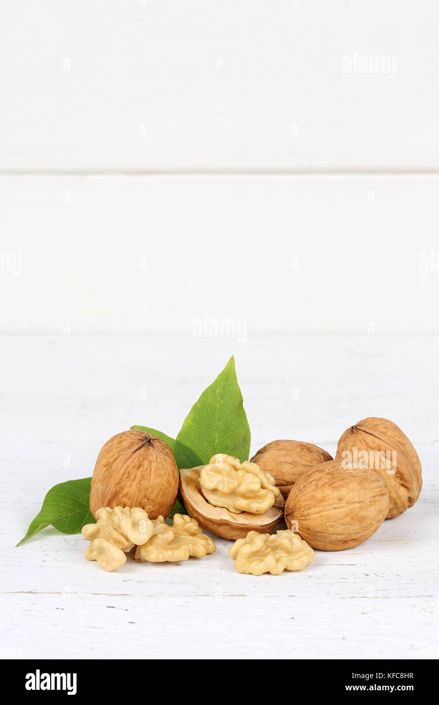 Walnuts walnut nuts portrait format copyspace on wooden board food Stock Photo