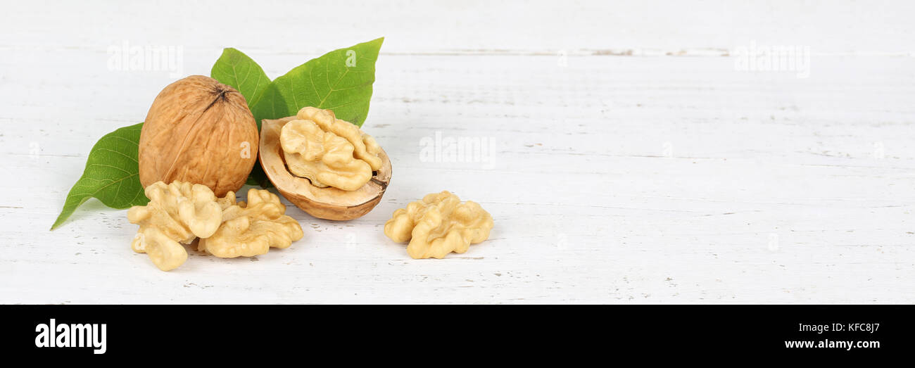Walnuts walnut nuts nut nutshell banner copyspace on wooden board food Stock Photo