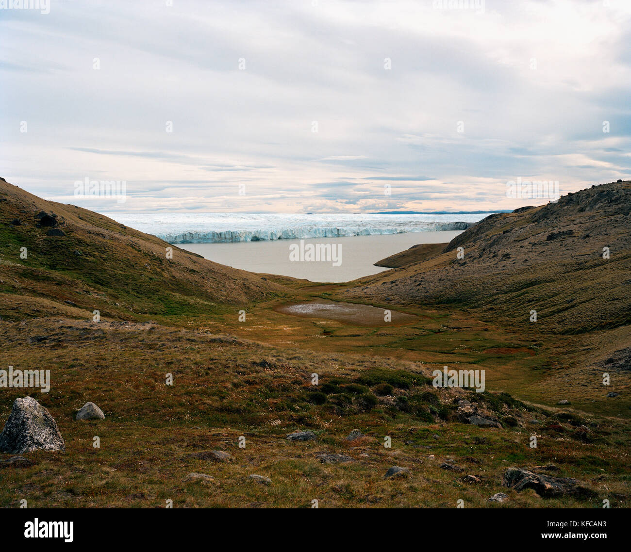 GREENLAND, Kangerlussuaq, Russel's Glacier in the background, landscape with sea against sky Stock Photo
