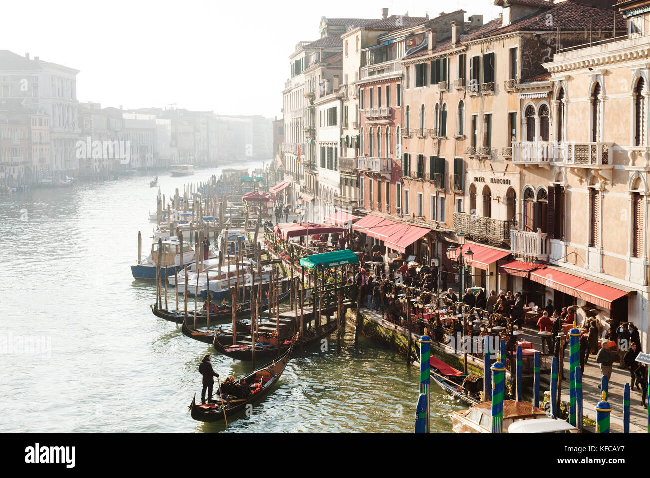 ITALY, Venice. View of the Grand Canal, homes and restaurants from the Rialto Bridge. Stock Photo