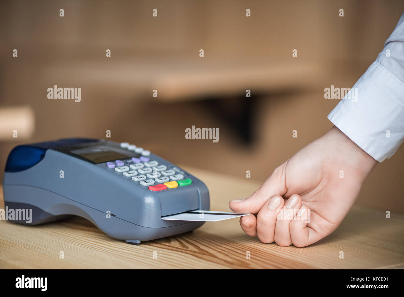 putting credit card into terminal Stock Photo - Alamy