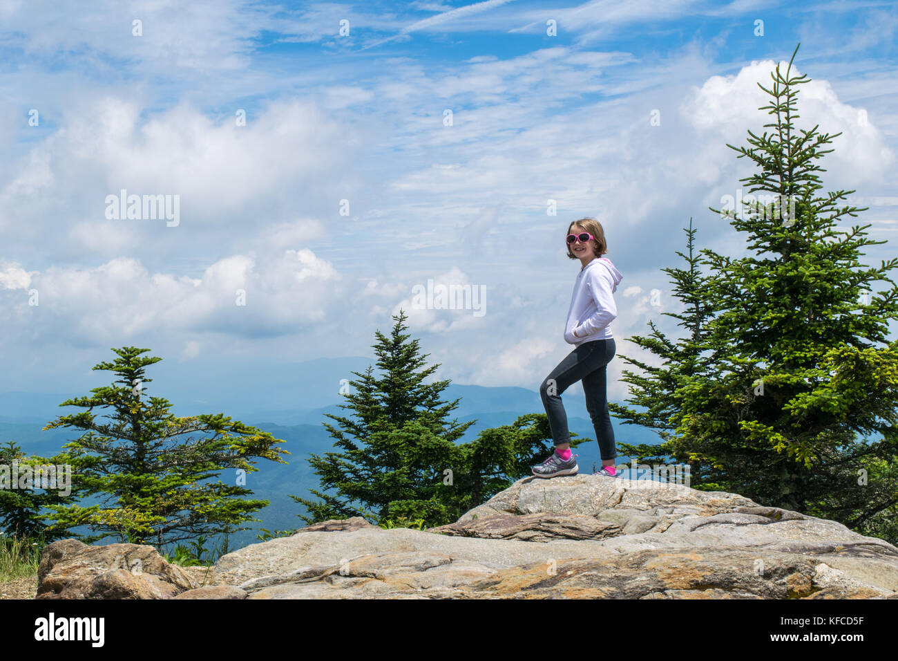 Girl standing on top of Mount Mitchell in the Blue Ridge Mountain, North Carolina Stock Photo